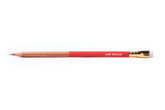 A close-up of a Blackwing Lab 02.22.22 pencil, part natural wood, part red, with red graphite and white eraser